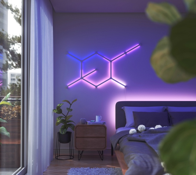 Office bedroom setup with Nanoleaf Lines RGB lights mounted above the desk and monitor. The perfect gaming lights for your PC battlestation.