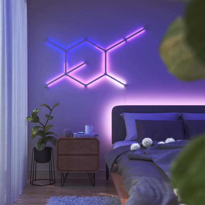 Office bedroom setup with Nanoleaf Lines RGB lights mounted above the desk and monitor. The perfect gaming lights for your PC battlestation.