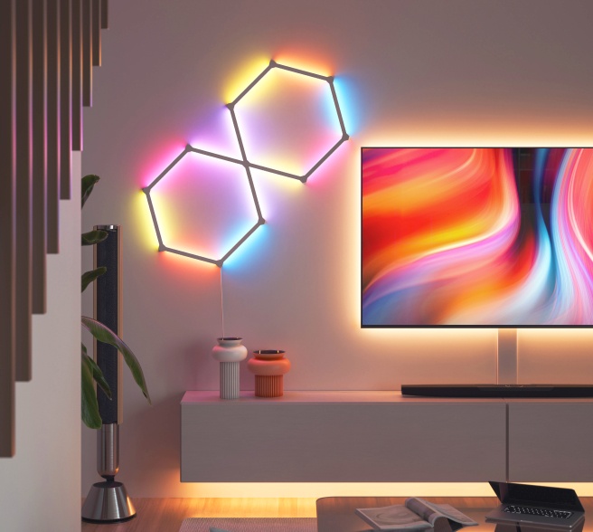 Office bedroom setup with Nanoleaf Lines RGB lights mounted above the desk and monitor. The perfect gaming lights for your PC battlestation.